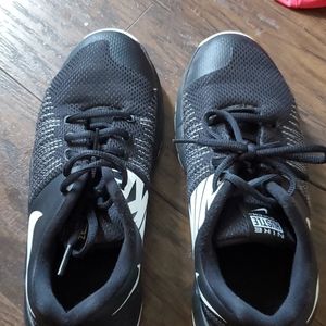 Black Nike basketball shoes.